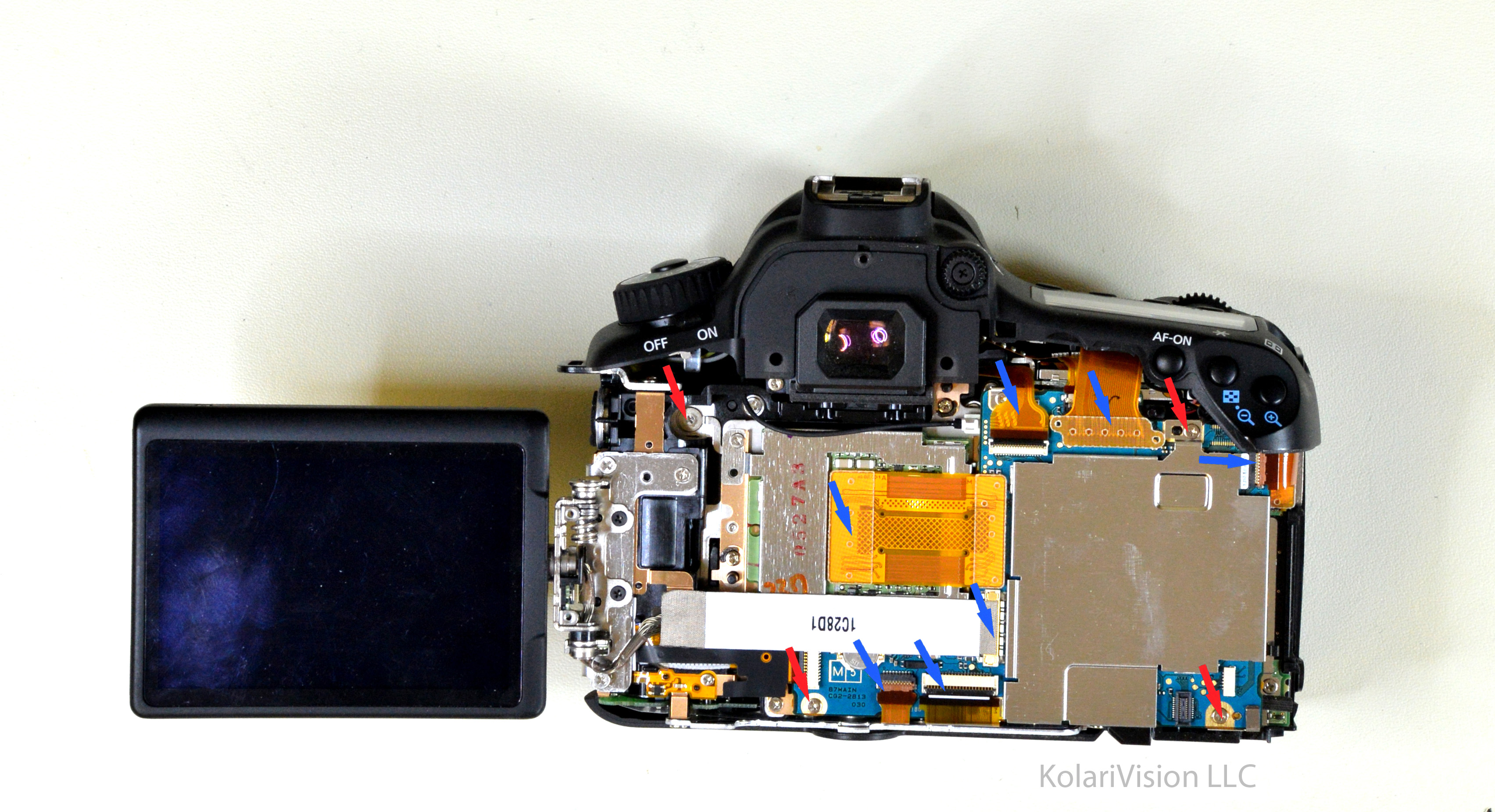 Canon EOS 60D Infrared Conversion DIY Tutorial and Disassembly Guide Blue arrows indicate to remove cables and Red arrows indicate to remove screws
