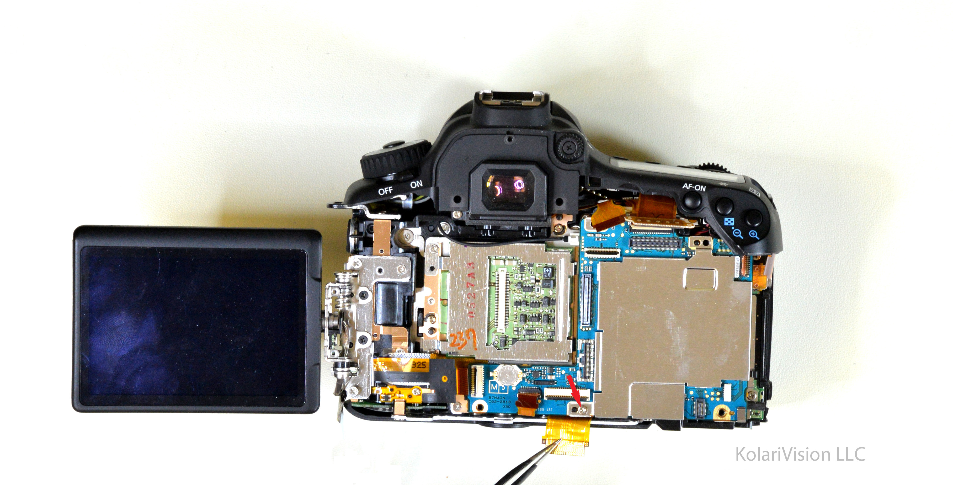Canon EOS 60D Infrared Conversion DIY Tutorial and Disassembly Guide Blue arrows indicate to remove cables and Red arrows indicate to remove screws