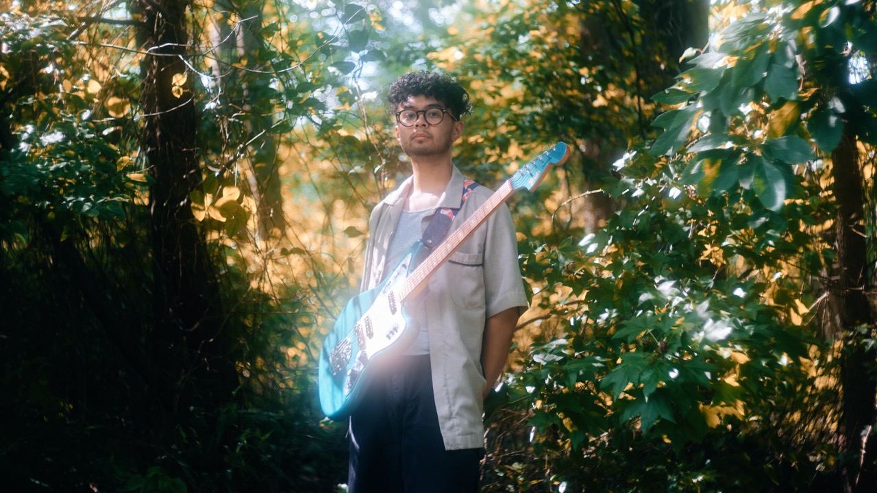 Portrait of a man in soft focus with a light, dreamy glow, demonstrating the cinematic effect of a mist diffusion filter.