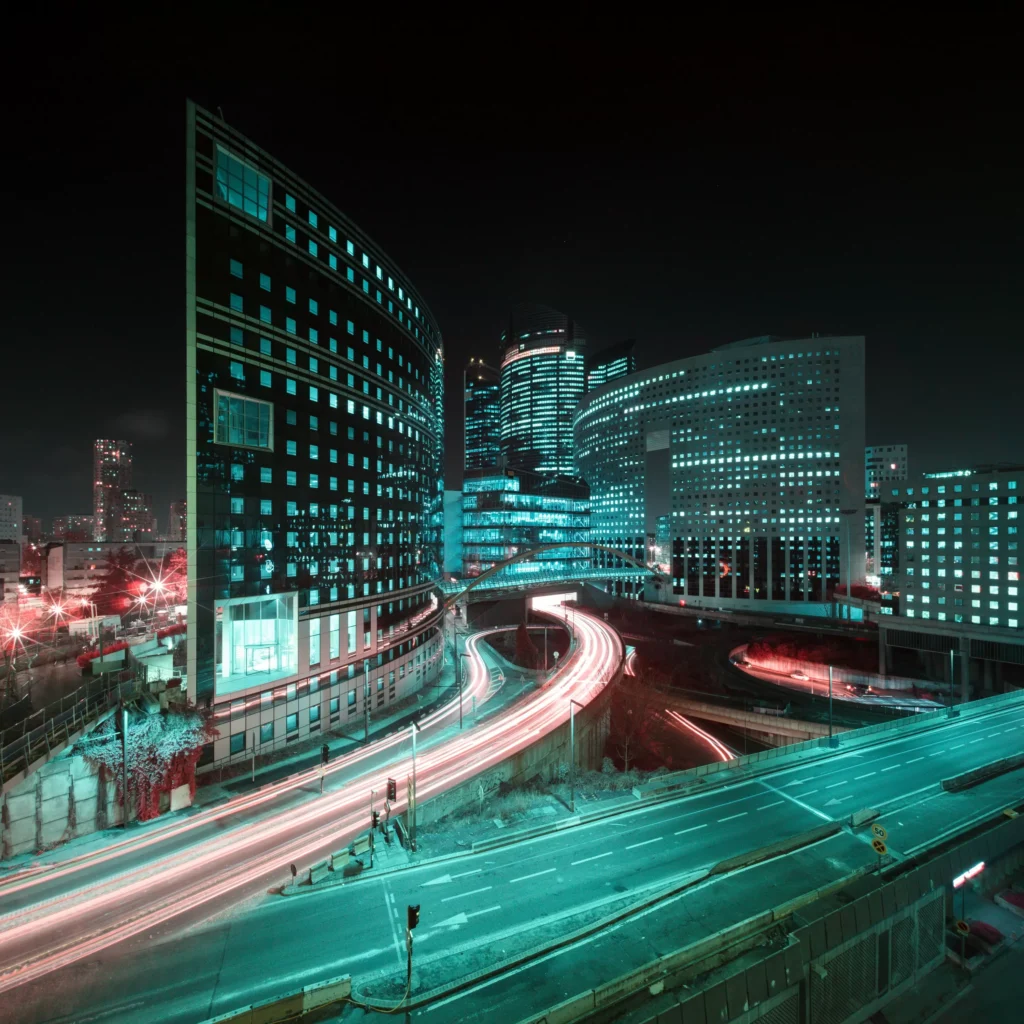 Futuristic cityscape with neon light trails captured in infrared using a neutral density filter to create a creative long exposure effect