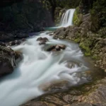 Thumbnail of Long exposure of Tawhai Falls, using a mist diffusion filter to turn the rushing cascade into silky smooth streams