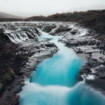 Thumbnail of Serene river reflecting the sky in a mirror like long exposure, captured with a mist diffusion filter